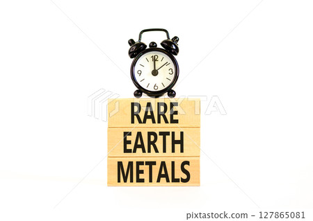 Rare earth metals symbol. Concept words Rare earth metals on beautiful wooden block. Black alarm clock. Beautiful white background. Business and rare earth metals concept. Copy space. Rare earth metals symbol. Concept words Rare earth metals on beautiful wooden block. Black alarm clock. Beautiful white background. Business and rare earth metals concept. Copy space. 127865081
