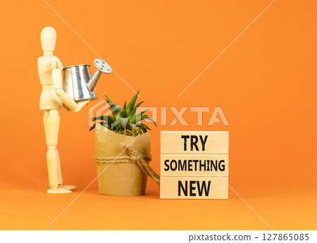Try something new symbol. Concept words Try something new on beautiful block. Businessman model. Beautiful orange background. Business motivational lifestyle try something new concept. Copy space. Try something new symbol. Concept words Try something new on beautiful block. Businessman model. Beautiful orange background. Business motivational lifestyle try something new concept. Copy space. 127865085