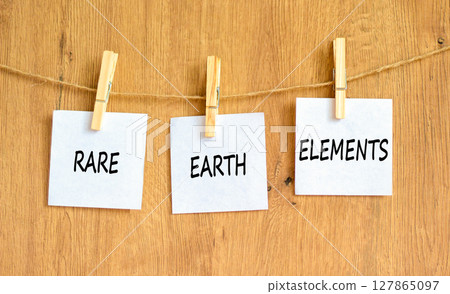 Rare earth elements symbol. Concept words Rare earth elements on beautiful white paper on wooden clothespin. Beautiful wooden background. Business and rare earth elements concept. Copy space. Rare earth elements symbol. Concept words Rare earth elements on beautiful white paper on wooden clothespin. Beautiful wooden background. Business and rare earth elements concept. Copy space. 127865097