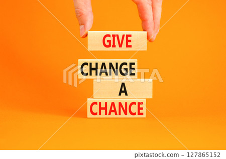 Give change a chance symbol. Concept words phrase Give change a chance on beautiful wooden blocks. Beautiful orange paper background Businessman's hand Business Give change a chance concept Copy space Give change a chance symbol. Concept words phrase Give change a chance on beautiful wooden blocks. Beautiful orange paper background Businessman's hand Business Give change a chance concept Copy space 127865152