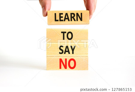 Learn to say no symbol. Concept words phrase Learn to say no on beautiful wooden blocks. Beautiful white paper background. Businessman's hand. Business psychological Learn to say no concept Copy space Learn to say no symbol. Concept words phrase Learn to say no on beautiful wooden blocks. Beautiful white paper background. Businessman's hand. Business psychological Learn to say no concept Copy space 127865153