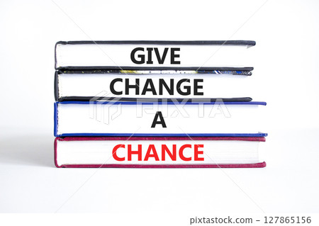 Give change a chance symbol. Concept words phrase Give change a chance on beautiful books. Beautiful white paper background. Business Give change a chance concept. Copy space. 127865156