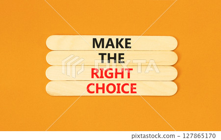 Make the right choice symbol. Concept words phrase Make the right choice on beautiful wooden stick. Beautiful orange paper background. Business Make the right choice concept. Copy space. Make the right choice symbol. Concept words phrase Make the right choice on beautiful wooden stick. Beautiful orange paper background. Business Make the right choice concept. Copy space. 127865170