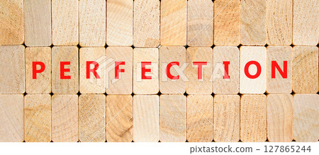 Perfection symbol. Concept word Perfection on beautiful wooden blocks. Beautiful wooden blocks background. Business perfection concept. Copy space. 127865244