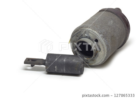 starter solenoid, with moveable iron core, extracted from the case, on white background, with clipping path 127865333