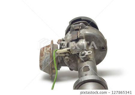 distributor of mechanical ignition system. capacitor, vacuum control unit, rotor housing. on white background, with clipping path 127865341