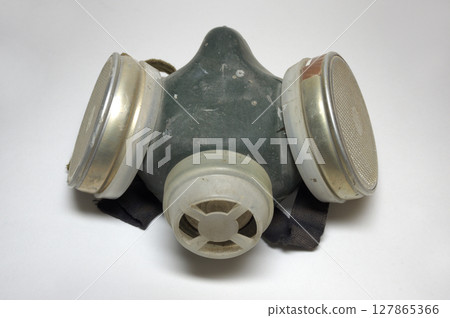 gas mask on half face, with dual replaceable filter cartridges. painting respirator for safety work while spraying. with clipping path 127865366