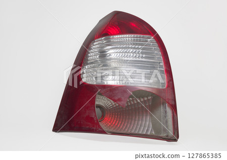 tail light of station wagon body car. broken plastic lens, on white background, with clipping path 127865385