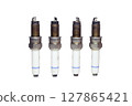spark plugs kit, old. dirty, worn, isolated on white background 127865421
