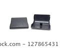 plastic end caps of metal obsolete car bumper, isolated on white background, with clipping path 127865431
