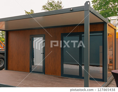 Cargo container on field 127865438