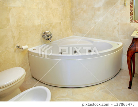 Vintage corner bathtub 127865473