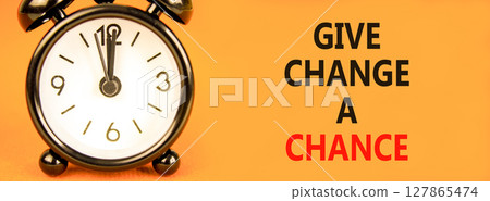 Give change a chance symbol. Concept words phrase Give change a chance on beautiful orange paper. Black alarm clock. Beautiful orange paper background. Business Give change a chance concept Copy space Give change a chance symbol. Concept words phrase Give change a chance on beautiful orange paper. Black alarm clock. Beautiful orange paper background. Business Give change a chance concept Copy space 127865474