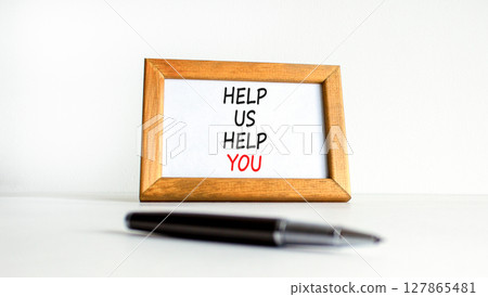 Help you symbol. Concept words phrase Help us help you on beautiful wooden picture frame. Black pen. Beautiful white background. Business Help you concept. Copy space. Help you symbol. Concept words phrase Help us help you on beautiful wooden picture frame. Black pen. Beautiful white background. Business Help you concept. Copy space. 127865481