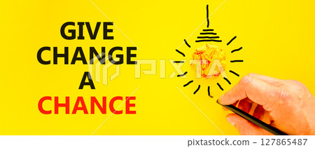 Give change a chance symbol. Concept words phrase Give change a chance on beautiful yellow paper. Businessman's hand. Beautiful yellow background. Business Give change a chance concept. Copy space. Give change a chance symbol. Concept words phrase Give change a chance on beautiful yellow paper. Businessman's hand. Beautiful yellow background. Business Give change a chance concept. Copy space. 127865487