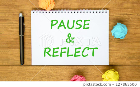 Pause and reflect symbol. Concept words Pause and reflect on beautiful white note. Colored paper. Beautiful wooden background. Business motivational lifestyle pause and reflect concept. Copy space. Pause and reflect symbol. Concept words Pause and reflect on beautiful white note. Colored paper. Beautiful wooden background. Business motivational lifestyle pause and reflect concept. Copy space. 127865500