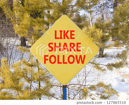 Like share follow symbol. Concept words Like Share Follow on beautiful yellow road sign. Beautiful snow forest background. Business like share follow concept. Copy space. Like share follow symbol. Concept words Like Share Follow on beautiful yellow road sign. Beautiful snow forest background. Business like share follow concept. Copy space. 127865510