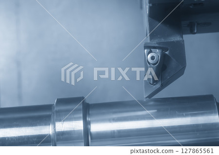 The CNC lathe machine forming cutting the metal shaft parts in the light blue scene. 127865561