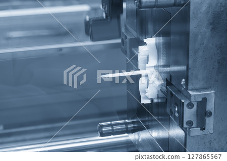 Close up scene the plastic parts from injection machine in the light blue scene. 127865567