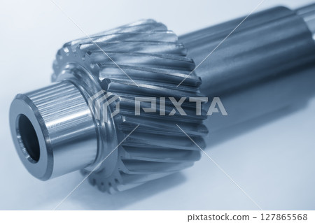 Close up the transmission bevel gear spare parts in the light blue scene. Close up the transmission bevel gear spare parts in the light blue scene. 127865568