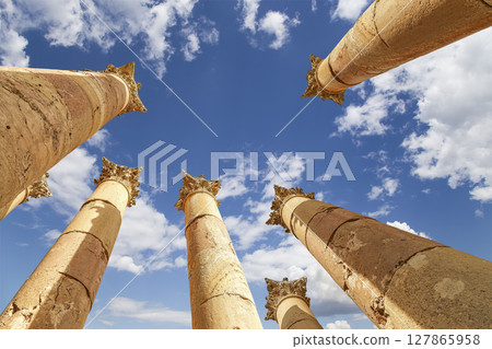 Roman Columns in the Jordanian city of Jerash (Gerasa of Antiquity), capital and largest city of Jerash Governorate, Jordan. Against the background of a beautiful sky with clouds Roman Columns in the Jordanian city of Jerash (Gerasa of Antiquity), capital and largest city of Jerash Governorate, Jordan. Against the background of a beautiful sky with clouds 127865958
