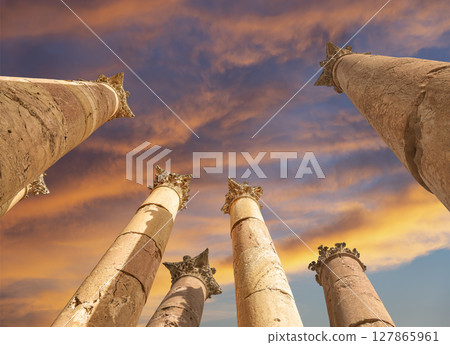 Roman Columns in the Jordanian city of Jerash (Gerasa of Antiquity), capital and largest city of Jerash Governorate, Jordan. Against the background of a beautiful sky with clouds Roman Columns in the Jordanian city of Jerash (Gerasa of Antiquity), capital and largest city of Jerash Governorate, Jordan. Against the background of a beautiful sky with clouds 127865961