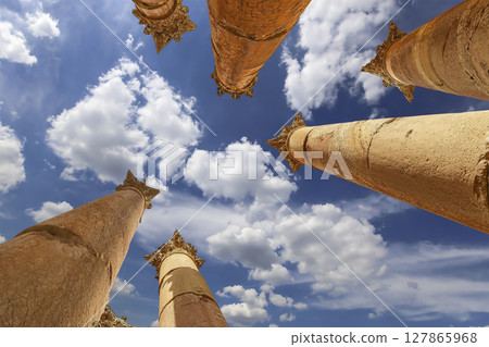 Roman Columns in the Jordanian city of Jerash (Gerasa of Antiquity), capital and largest city of Jerash Governorate, Jordan. Against the background of a beautiful sky with clouds Roman Columns in the Jordanian city of Jerash (Gerasa of Antiquity), capital and largest city of Jerash Governorate, Jordan. Against the background of a beautiful sky with clouds 127865968