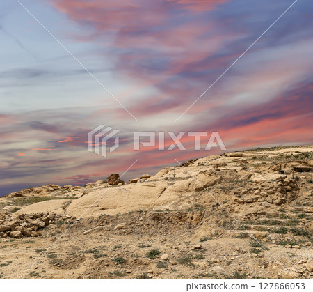 Mountains of Petra (against the background of a beautiful sky with clouds), Jordan, Middle East. Petra has been a UNESCO World Heritage Site since 1985 127866053