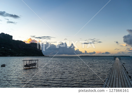 Sunset over the tranquil lagoon of Maupiti, French Polynesia 127866161