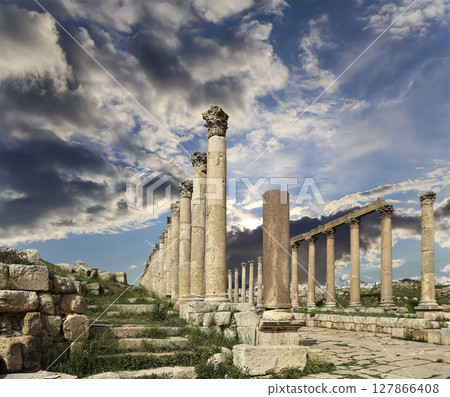 Roman Columns in the Jordanian city of Jerash (Gerasa of Antiquity), capital and largest city of Jerash Governorate, Jordan. Against the background of a beautiful sky with clouds Roman Columns in the Jordanian city of Jerash (Gerasa of Antiquity), capital and largest city of Jerash Governorate, Jordan. Against the background of a beautiful sky with clouds 127866408