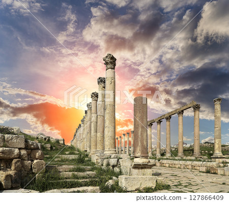 Roman Columns in the Jordanian city of Jerash (Gerasa of Antiquity), capital and largest city of Jerash Governorate, Jordan. Against the background of a beautiful sky with clouds Roman Columns in the Jordanian city of Jerash (Gerasa of Antiquity), capital and largest city of Jerash Governorate, Jordan. Against the background of a beautiful sky with clouds 127866409