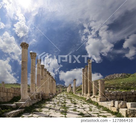 Roman Columns in the Jordanian city of Jerash (Gerasa of Antiquity), capital and largest city of Jerash Governorate, Jordan. Against the background of a beautiful sky with clouds 127866410