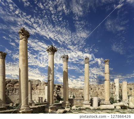 Roman Columns in the Jordanian city of Jerash (Gerasa of Antiquity), capital and largest city of Jerash Governorate, Jordan. Against the background of a beautiful sky with clouds 127866426