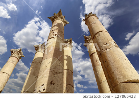 Roman Columns in the Jordanian city of Jerash (Gerasa of Antiquity), capital and largest city of Jerash Governorate, Jordan. Against the background of a beautiful sky with clouds Roman Columns in the Jordanian city of Jerash (Gerasa of Antiquity), capital and largest city of Jerash Governorate, Jordan. Against the background of a beautiful sky with clouds 127866428