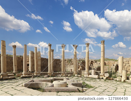 Roman Columns in the Jordanian city of Jerash (Gerasa of Antiquity), capital and largest city of Jerash Governorate, Jordan. Against the background of a beautiful sky with clouds 127866430