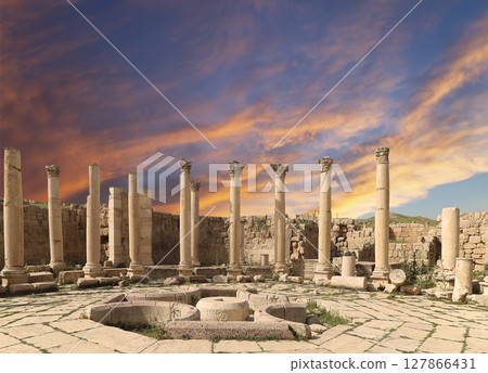 Roman Columns in the Jordanian city of Jerash (Gerasa of Antiquity), capital and largest city of Jerash Governorate, Jordan. Against the background of a beautiful sky with clouds 127866431