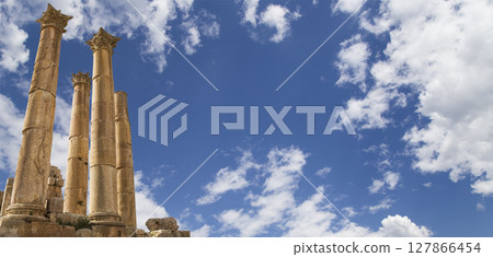 Roman Columns in the Jordanian city of Jerash (Gerasa of Antiquity), capital and largest city of Jerash Governorate, Jordan. Against the background of a beautiful sky with clouds Roman Columns in the Jordanian city of Jerash (Gerasa of Antiquity), capital and largest city of Jerash Governorate, Jordan. Against the background of a beautiful sky with clouds 127866454