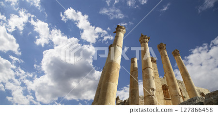 Roman Columns in the Jordanian city of Jerash (Gerasa of Antiquity), capital and largest city of Jerash Governorate, Jordan. Against the background of a beautiful sky with clouds 127866458
