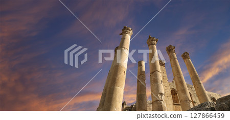 Roman Columns in the Jordanian city of Jerash (Gerasa of Antiquity), capital and largest city of Jerash Governorate, Jordan. Against the background of a beautiful sky with clouds Roman Columns in the Jordanian city of Jerash (Gerasa of Antiquity), capital and largest city of Jerash Governorate, Jordan. Against the background of a beautiful sky with clouds 127866459