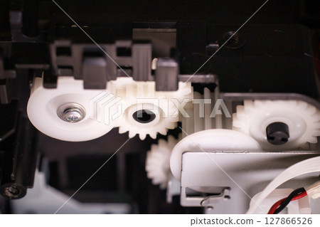 Plastic gears inside the circuit board of a home appliance Plastic gears inside the circuit board of a home appliance 127866526