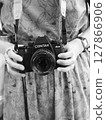 A woman with a camera 127866906