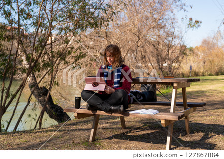 Remote Work in Nature. A Peaceful Outdoor Workspace by the River 127867084