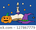 A composition of a magic book, a smiling pumpkin and a candle in a candlestick 127867779
