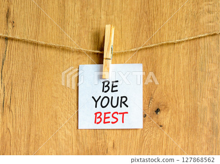 Motivational be your best symbol. Concept words Be your best on beautiful white paper on clothespin. Beautiful wooden background. Business motivational be your best concept. Copy space. 127868562