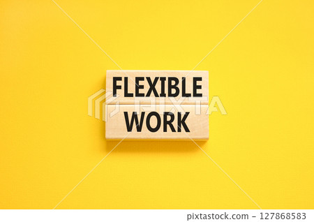 Flexible work symbol. Concept words Flexible work on beautiful wooden block. Beautiful yellow paper background. Business Flexible work concept. Copy space. 127868583
