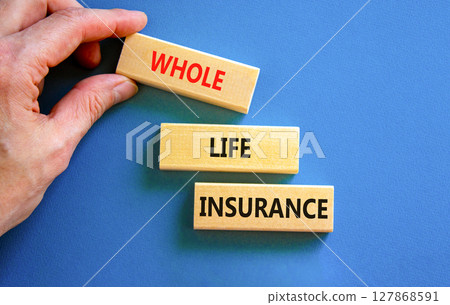 Whole life insurance symbol. Concept words Whole life insurance on beautiful wooden blocks. Beautiful blue background. Businessman hand. Business whole life insurance concept. Copy space. Whole life insurance symbol. Concept words Whole life insurance on beautiful wooden blocks. Beautiful blue background. Businessman hand. Business whole life insurance concept. Copy space. 127868591