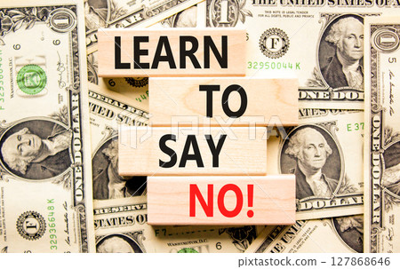 Learn to say no symbol. Concept words phrase Learn to say no on beautiful wooden blocks. Dollar bills. Beautiful dollar bills background. Business psychological Learn to say no concept. Copy space. 127868646