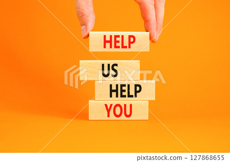 Help you symbol. Concept words phrase Help us help you on beautiful wooden blocks. Beautiful orange paper background. Businessman's hand. Business Help you concept. Copy space. Help you symbol. Concept words phrase Help us help you on beautiful wooden blocks. Beautiful orange paper background. Businessman's hand. Business Help you concept. Copy space. 127868655
