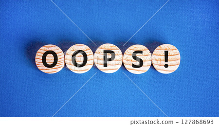 Oops symbol. Concept word Oops on beautiful wooden circles. Beautiful blue table blue background. Business lifestyle oops concept. Copy space. Oops symbol. Concept word Oops on beautiful wooden circles. Beautiful blue table blue background. Business lifestyle oops concept. Copy space. 127868693