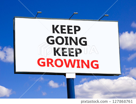 Keep going and growing symbol. Concept words phrase Keep going keep growing on beautiful big white billboard. Beautiful blue sky cloud background. Business Keep going and growing concept. Copy space. 127868761